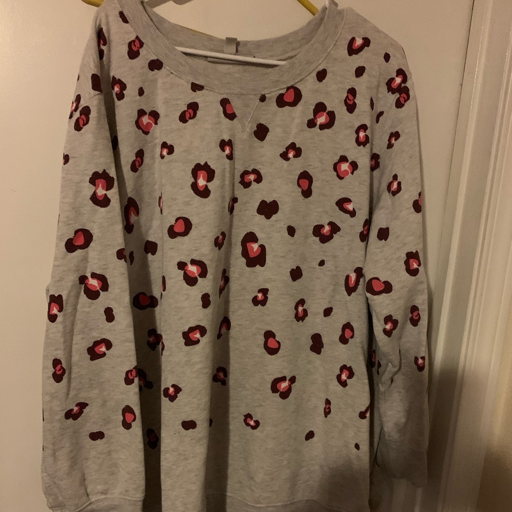 Woman within animal print sweatshirt